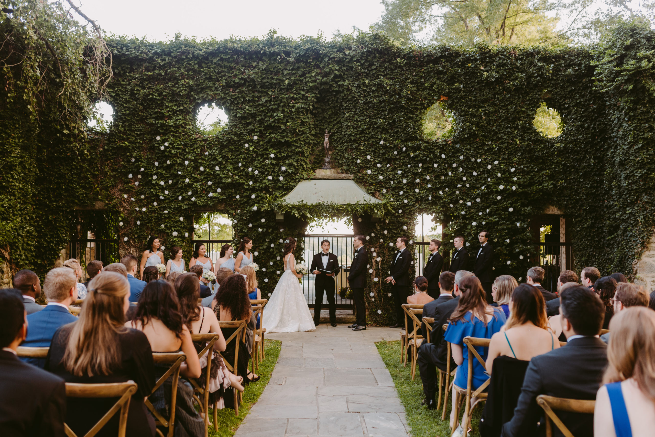 Bride and groom in front of ivy wall. French inspired Goodstone Inn wedding. Photo by Washington DC wedding photographer Victoria Heer.