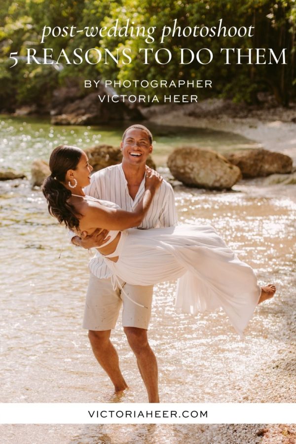 Husband Errol Barnett carries his wife Ariana Tolbert in his arms along a beach in Jamaica during their post-wedding photoshoot. Image by luxury wedding photographer Victoria Heer. Text overlays the image that reads, post-wedding photoshoot 5 reasons to do them.