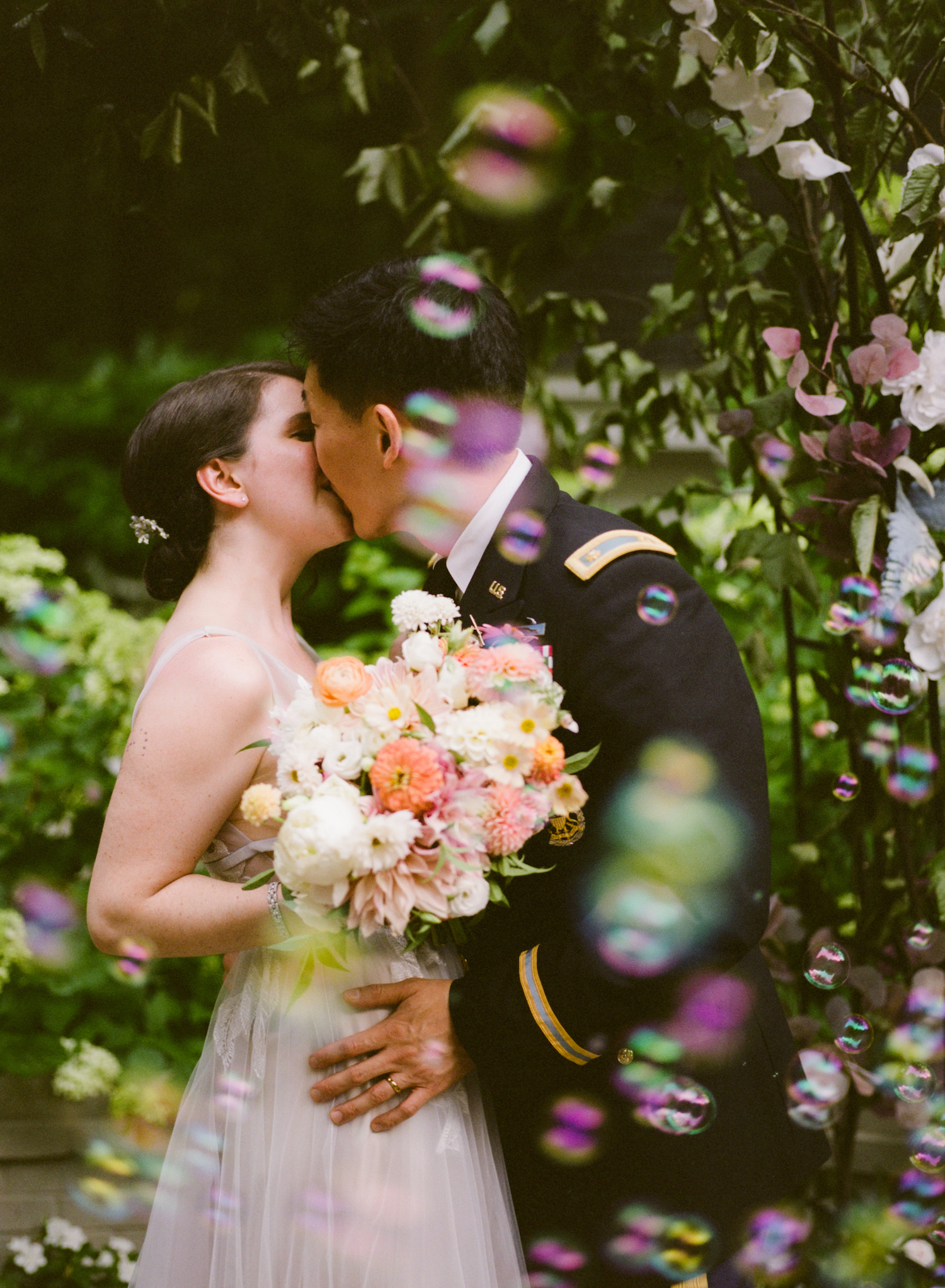 Bride and groom kiss in the garden during their wedding. Image by Victoria Heer, Washington DC wedding photographer as an example of an image you'd like to see when you ask your wedding photographer these 5 questions.
