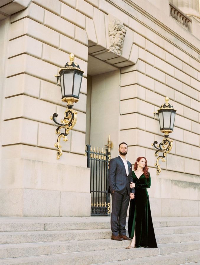 An engaged couple pose on the steps of Mellon Auditorium, a luxury Wedding venue in Washington DC. Image by Victoria Heer, fine art wedding photographer.